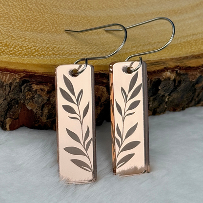 Rose gold mirrored acrylic earrings with  engraved leaf design. Lightweight and modern