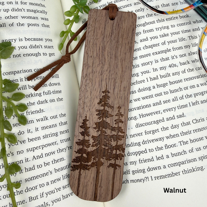 Wooden bookmark with tree engraving on a book page, walnut wood.