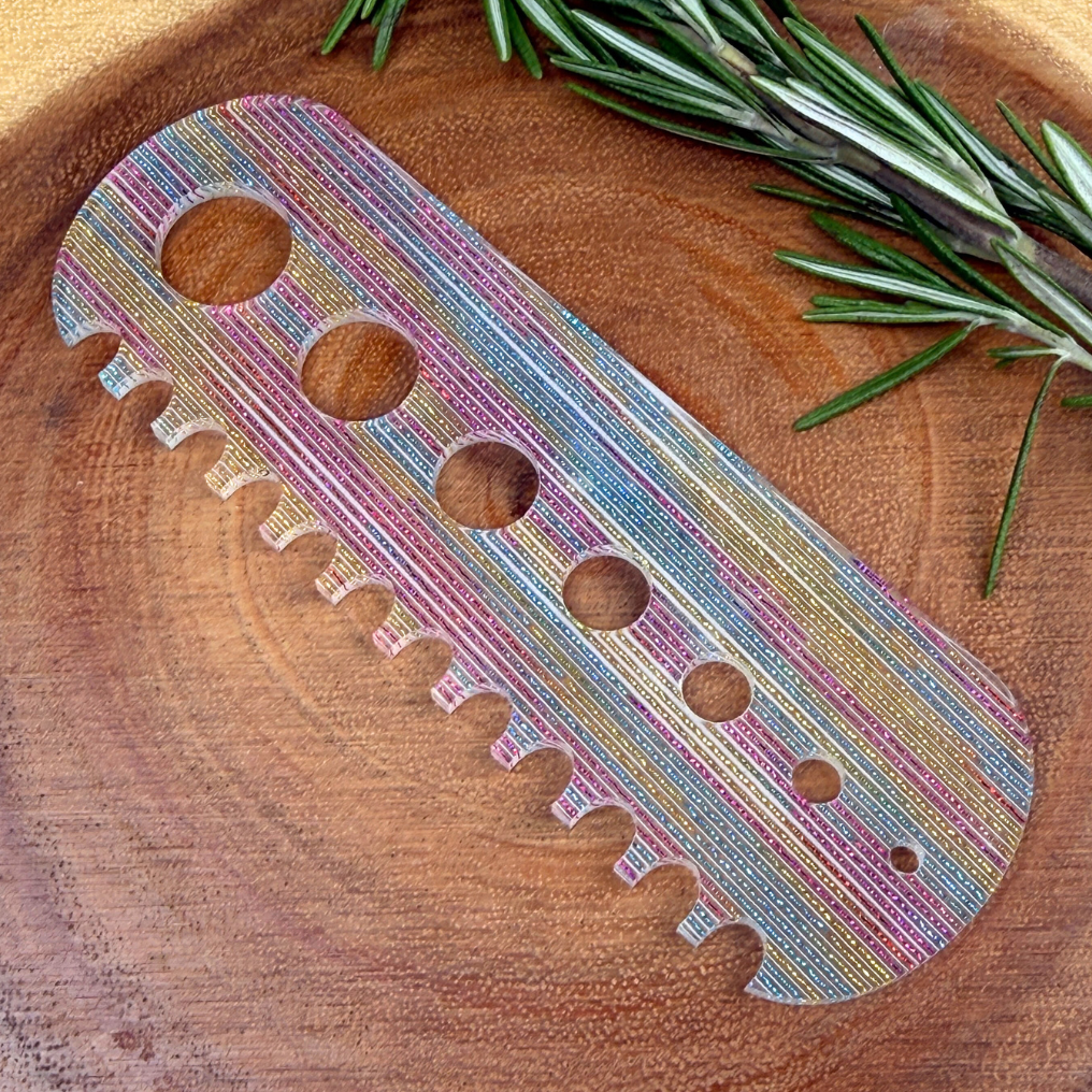 Colourful herb stripper with 7 different hole sizes.