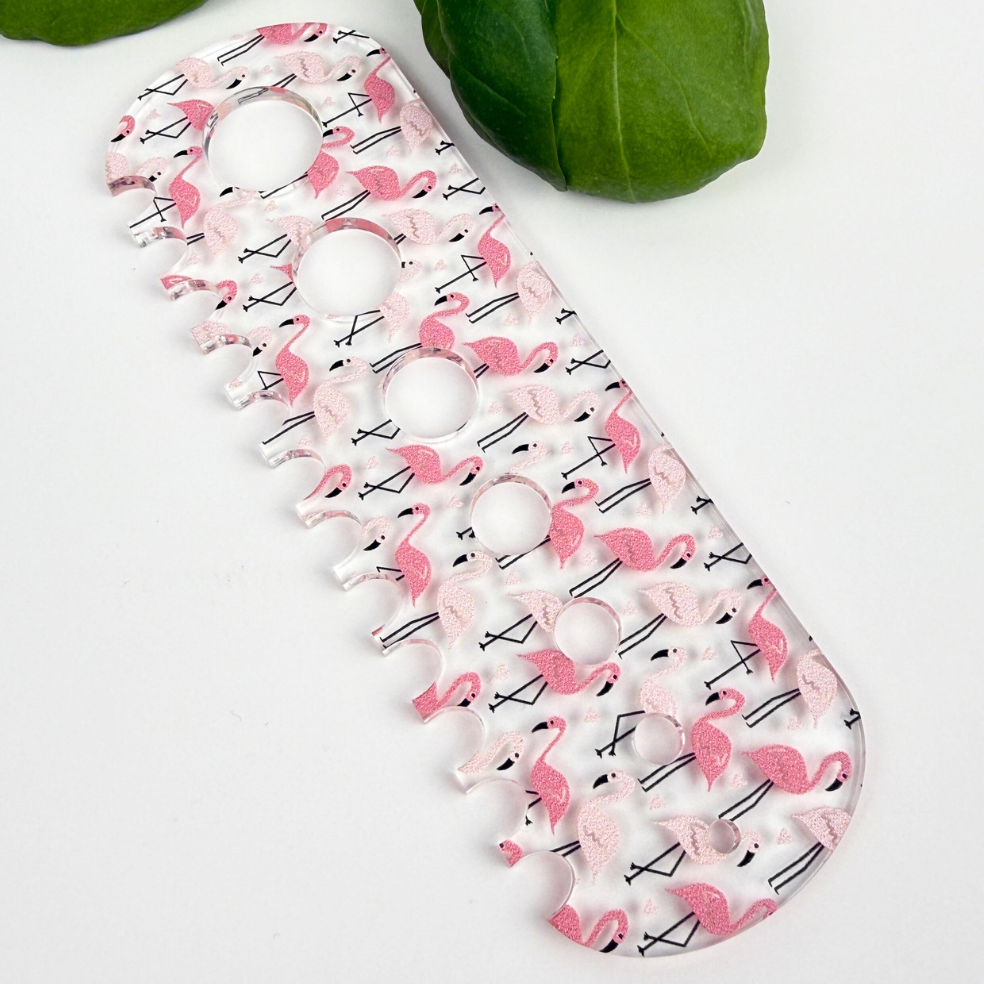 Pink flamingo herb stripper with 7 different hole sizes