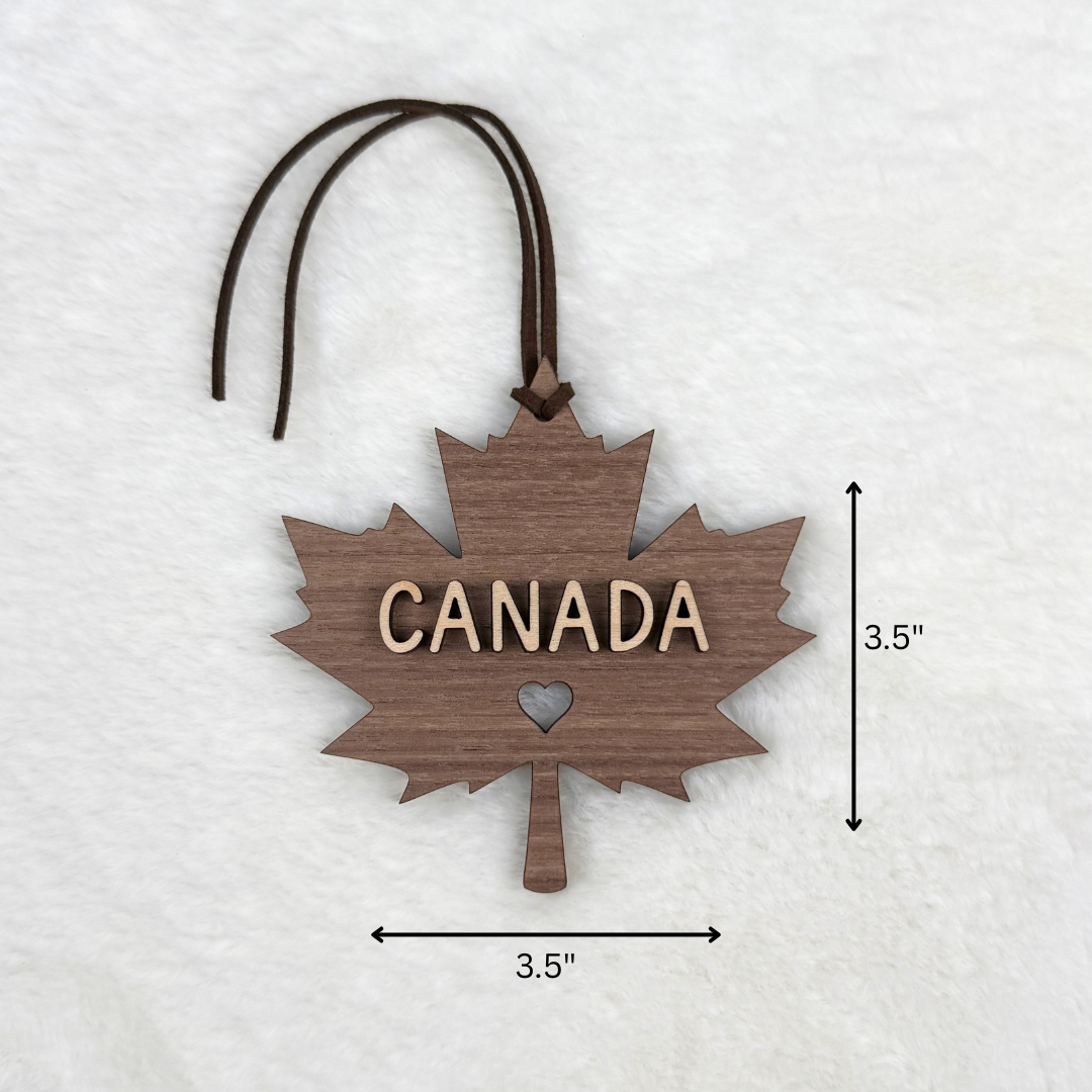 Canadian maple leaf wood ornament measuring 3.5 inches wide by 3.5 inches tall