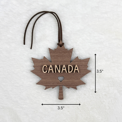 Canadian maple leaf wood ornament measuring 3.5 inches wide by 3.5 inches tall