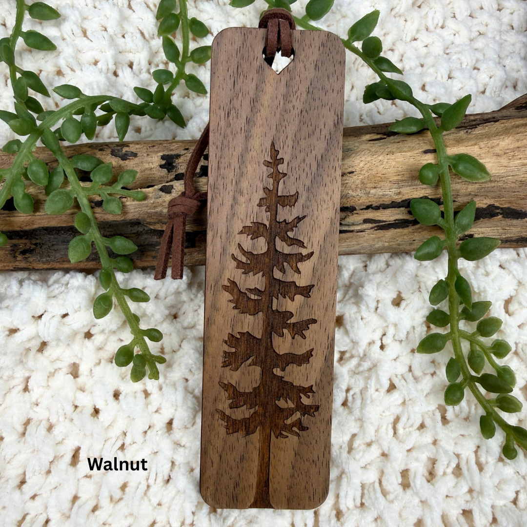 Walnut wood bookmark with tree engraving on a natural background