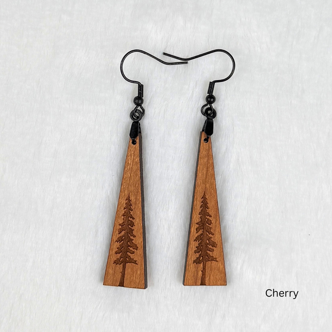 Wooden earrings with an engraved tree design made from cherry wood and finished with vegan wood oil. Triangle shape with black stainless steel hooks.
