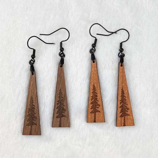 Wooden earrings with an engraved tree design made from walnut or cherry wood and finished with vegan wood oil. Triangle shape with black stainless steel hooks.