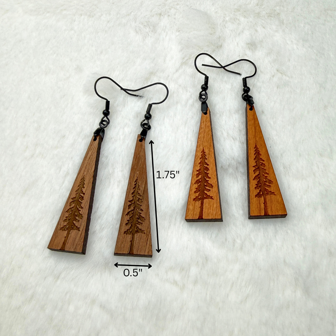 Wooden earrings with an engraved tree design made from walnut or cherry wood and finished with vegan wood oil. Triangle shape with black stainless steel hooks. Size is 1.75 inches by 0.5 inches.