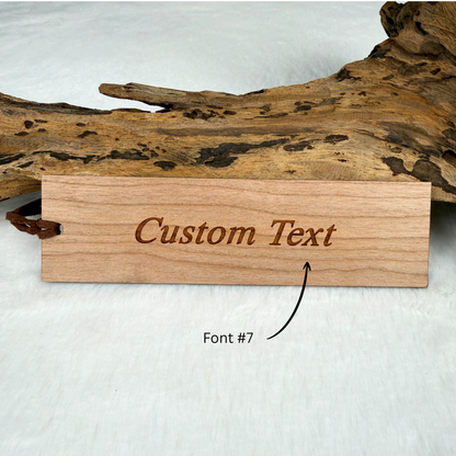 Example of personalized text engraved on the back of a wooden bookmark.