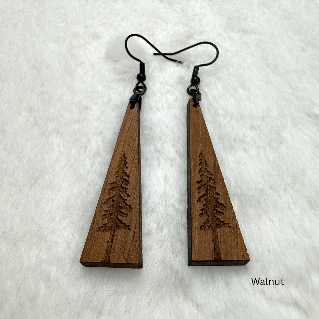 Wooden earrings with an engraved tree design made from walnut wood and finished with vegan wood oil. Triangle shape with black stainless steel hooks.