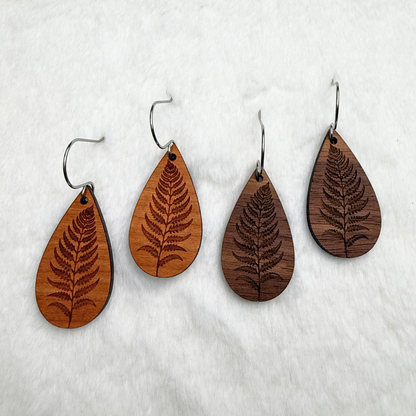 Fern leaf wooden earrings with stainless steel hooks. Finished with vegan wood oil. Laser engraved from walnut or cherry wood, handmade in Canada.